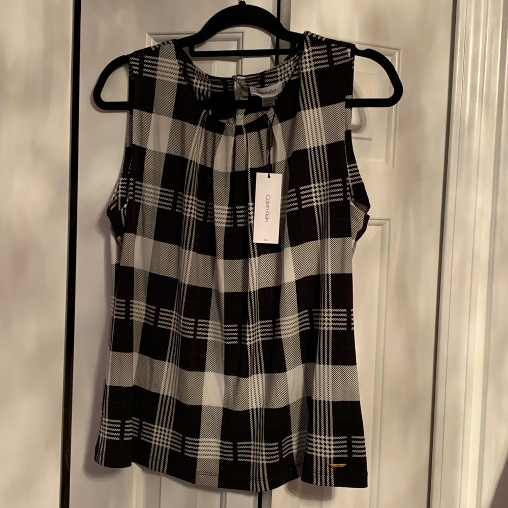 Calvin Klein’s sleeveless top! NEW with tags!